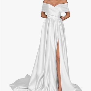 Never worn wedding dress. It’s satin and has a pull string corset.